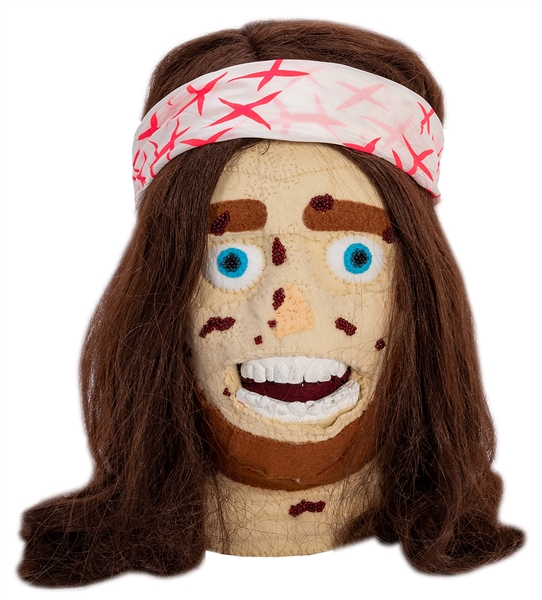  Diseased Mannequin Head. A long-haired hippie with headband...