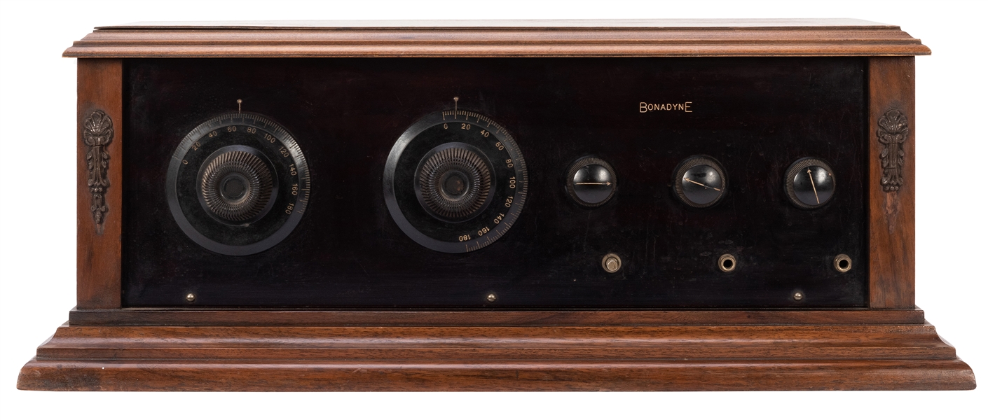  Bonadyne Radio. Hardwood cabinet with lid. Five knobs. Mech...