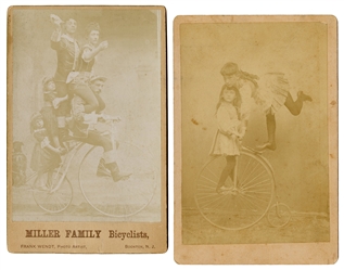  Two cabinet photographs of performing bicyclists. Two sepia...