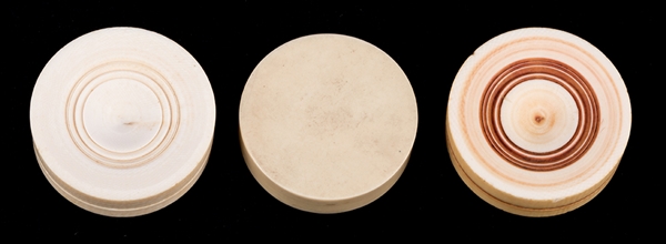 Three Large Round Ivory Game Pieces.