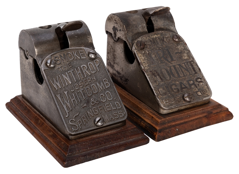 Pair of Cast Iron Cigar Cutters on Wood Base.