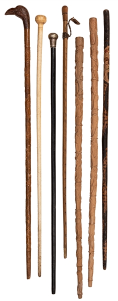 A Group of Seven Relief Carved and Other Antique Walking Canes.