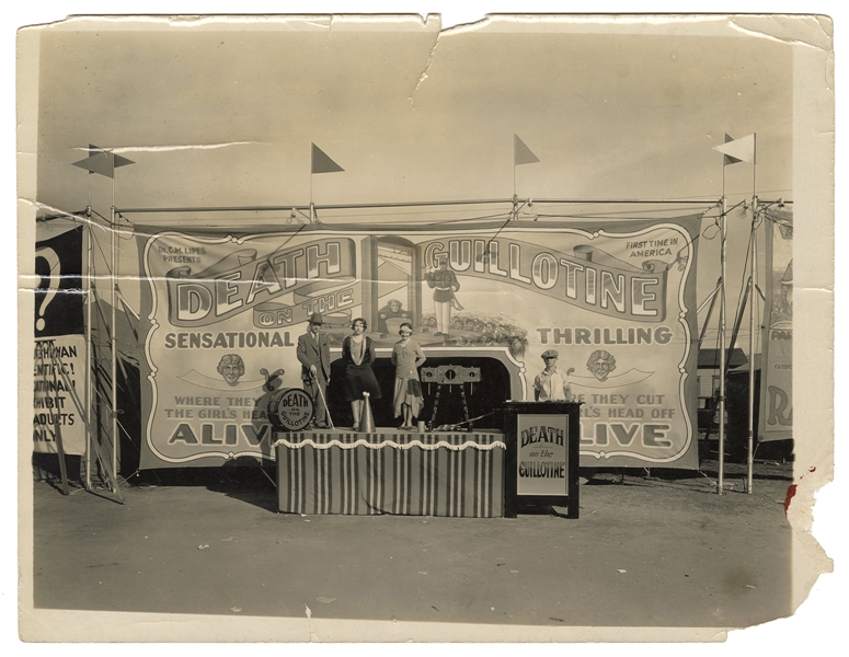 Photograph of a Sideshow Guillotine Illusion and Banner.