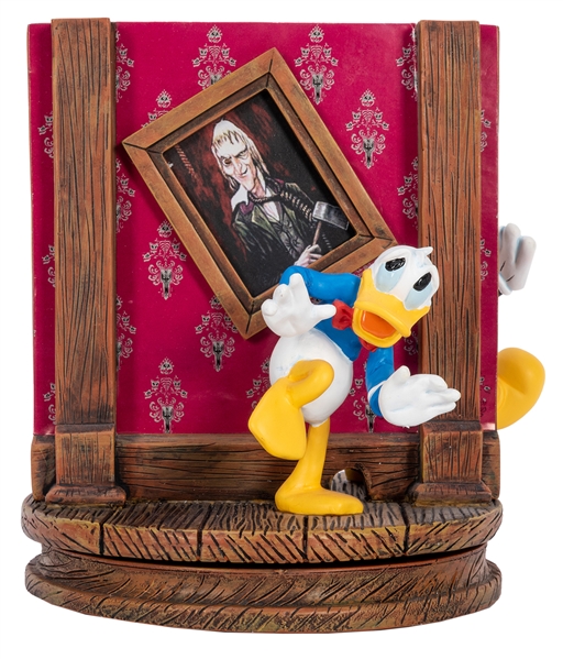 Haunted Mansion Sculpture with Mickey Mouse, Goofy, and Donald Duck.