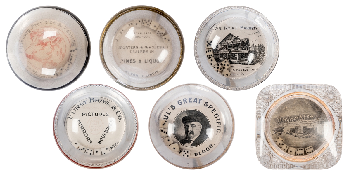 Six Round Glass Advertising Paperweights with Dice.