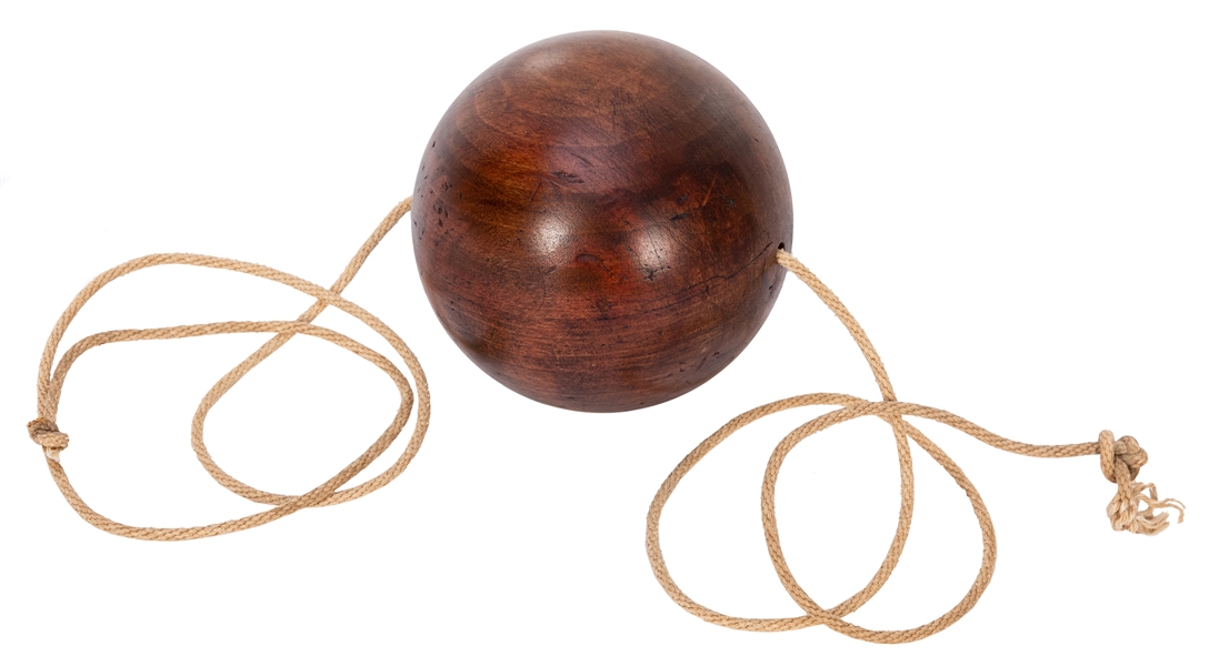  Obedient Ball. Circa 1930. A hardwood ball threaded on a co...