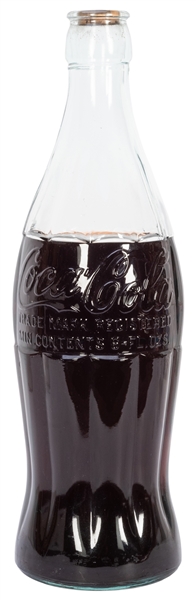  Giant Glass Coke Bottle. Filled with liquid. Height 22 ½”.
