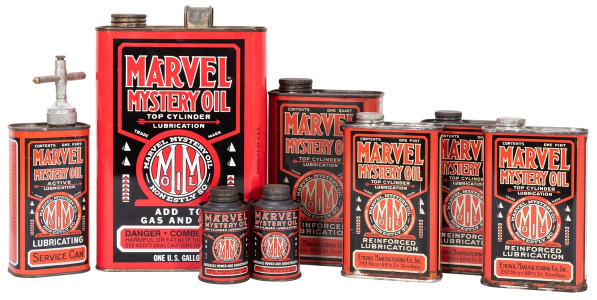  Marvel Mystery Oil. Eight Cans. Red and black oil cans in a...