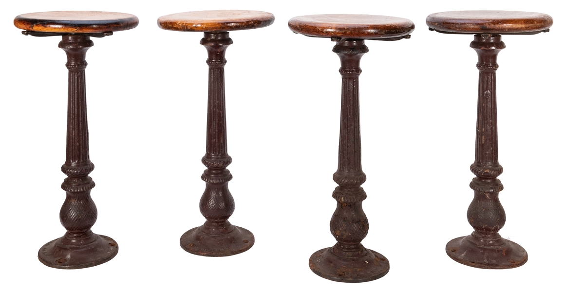 Four Cast Iron Bar Stools from Reeves Restaurant & Bakery. 