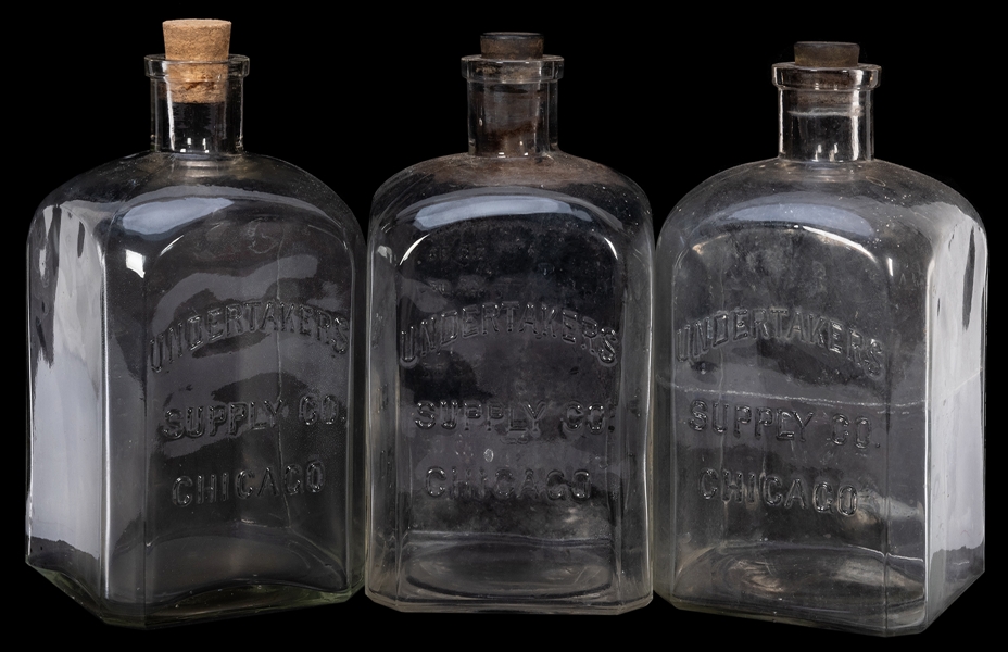  Undertakers Supply Co. Embalming Fluid Bottles. Three clear...