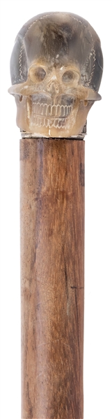  Skull Walking Cane. Wooden cane with carved mineral/stone k...