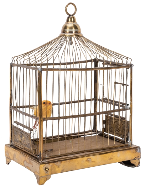  Appearing Canary in Cage. Circa 1920. Brass cage in which a...