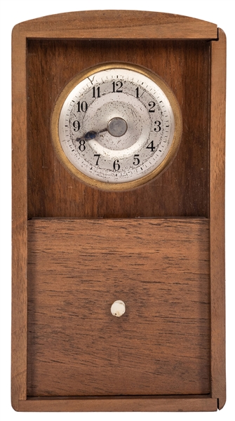  Wonder Clock. German, ca. 1930. Wooden case holds a metal c...