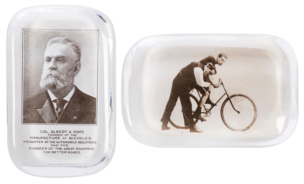  Pair of Bicycle-Related Glass Paperweights. Including paper...