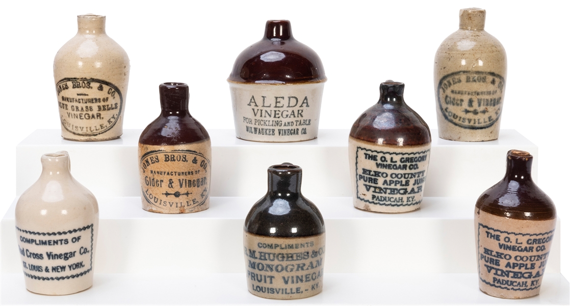  Eight Miniature Vinegar Advertising Stone Jugs. Companies i...