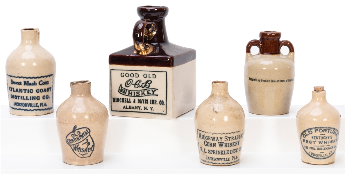  Six Miniature Whiskey Advertising Stone Jugs. Companies inc...