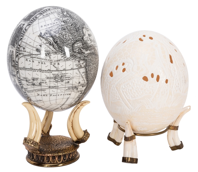  Pair of Ostrich Eggs. Including one carved and signed by Jo...