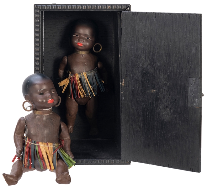  Doll Production Cabinet. German, 1950s. A small African dol...