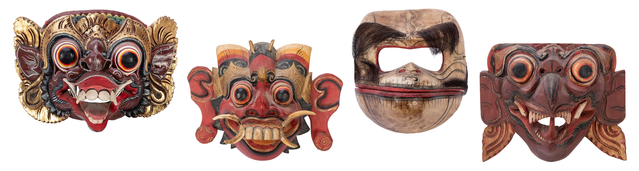  Four Wooden Indonesian Masks. Hand painted, one with articu...