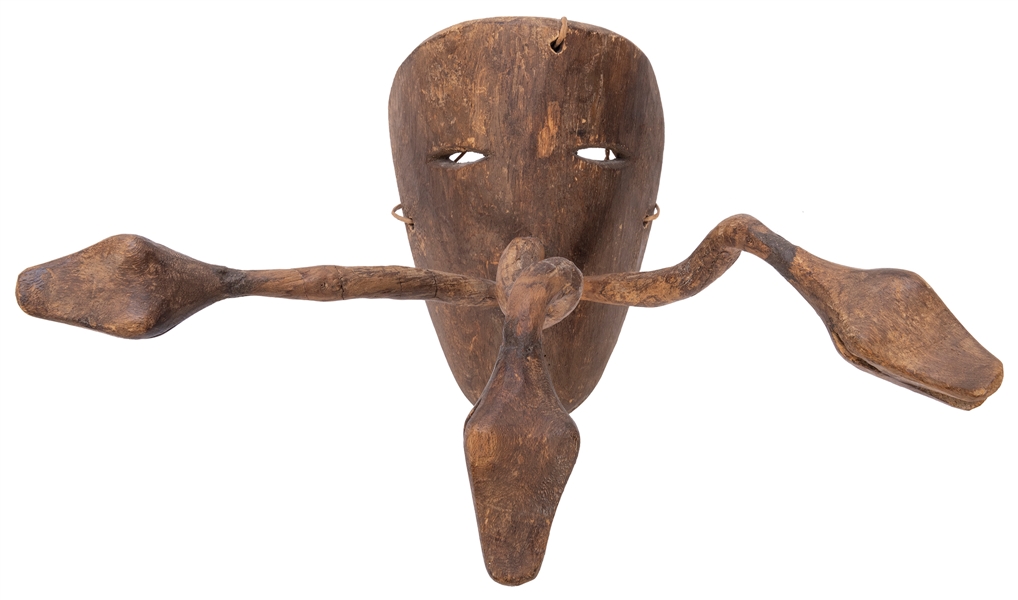  A Mexican Festival Mask. Wood. With eye slits and three car...