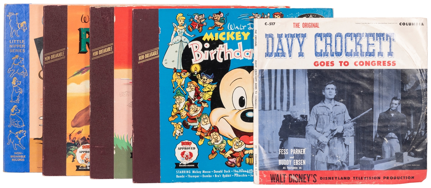  [DISNEY]. A group of collectibles including: (5) Walt Disne...