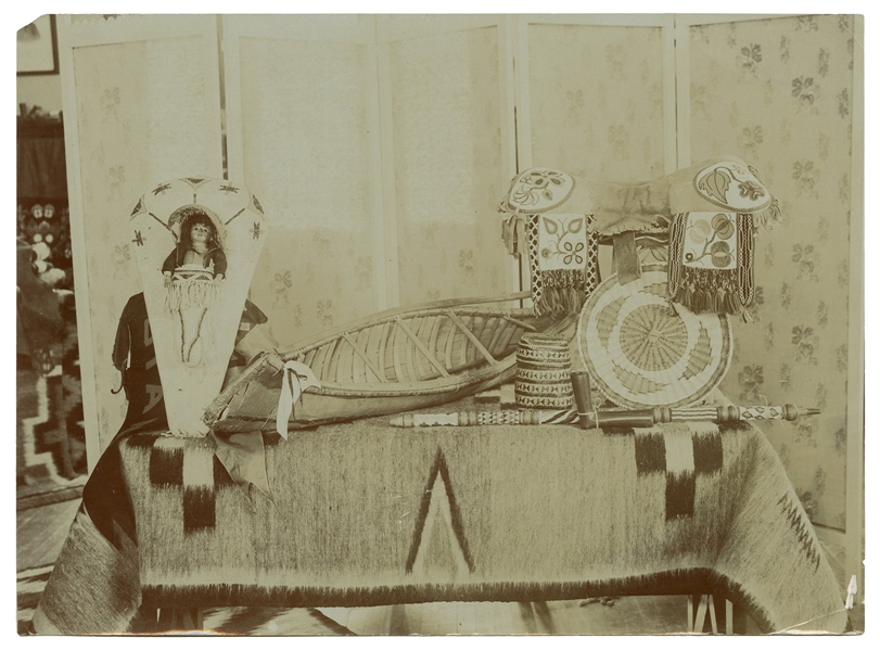  [AMERICAN INDIAN]. Photograph of a cradleboard and other ha...