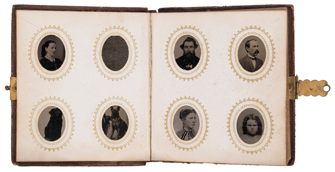  An album of miniature tintypes. Clasping gutta-percha album...