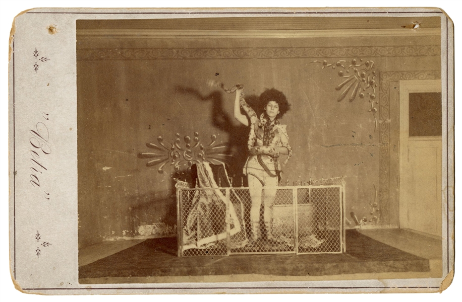  [SNAKE CHARMER]. BETRA, Millie. Cabinet card portrait. Circ...