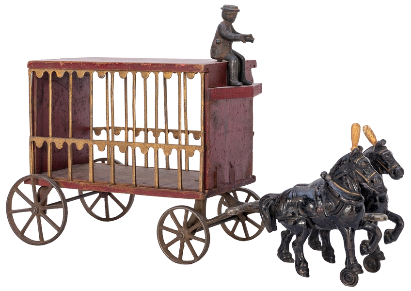  Arcade Circus Wagon Toy. Circa 1910s. Cast iron, metal, and...