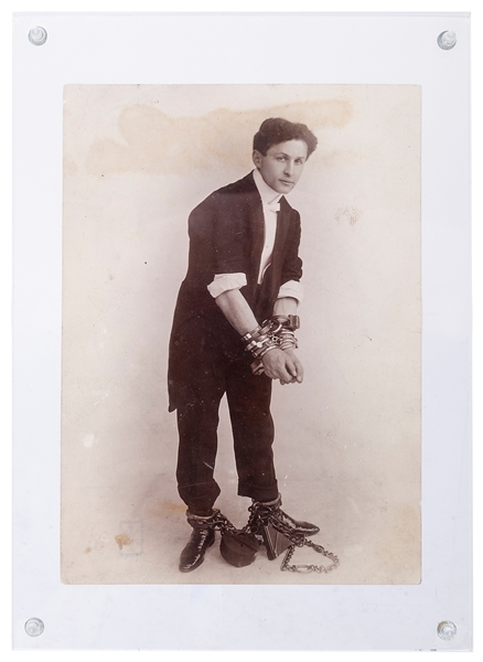 HOUDINI, Harry (Ehrich Weisz). Photograph of Houdini in Cuffs and Chains. Circa 