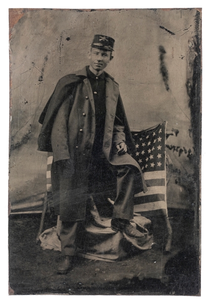  [CIVIL WAR]. Tintype of infantry soldier with kepi and flag...