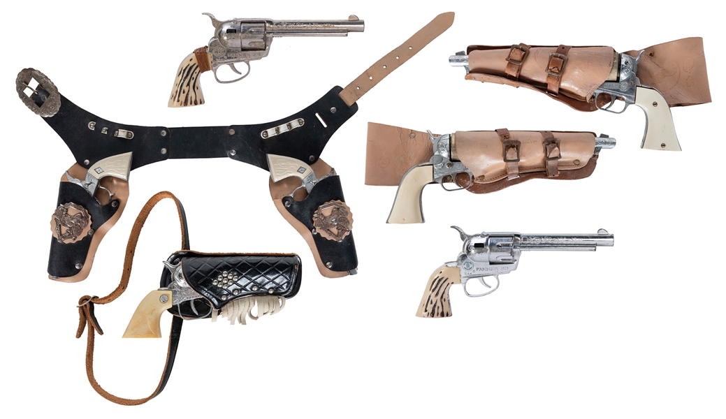  Group of Western / cowboy toy and cap pistols with holsters...