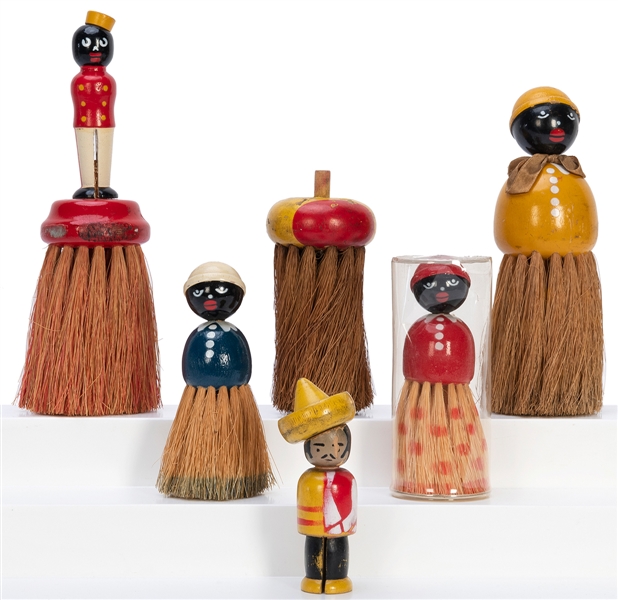  Group of 4 African-American themed clothes brushes, and one...