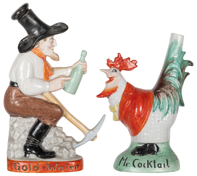  Group of 2 small painted ceramic liquor decanters. One is a...