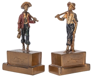 [CLEMENS, Samuel Langhorne ("Mark Twain") (1835–1910)]. A pair of Huckleberry Finn and Tom Sawyer polychrome bronze–clad bookends. Taunton, MA: Armor Bronze Co., ca. 1930s. <p>Height of each, 8”....
