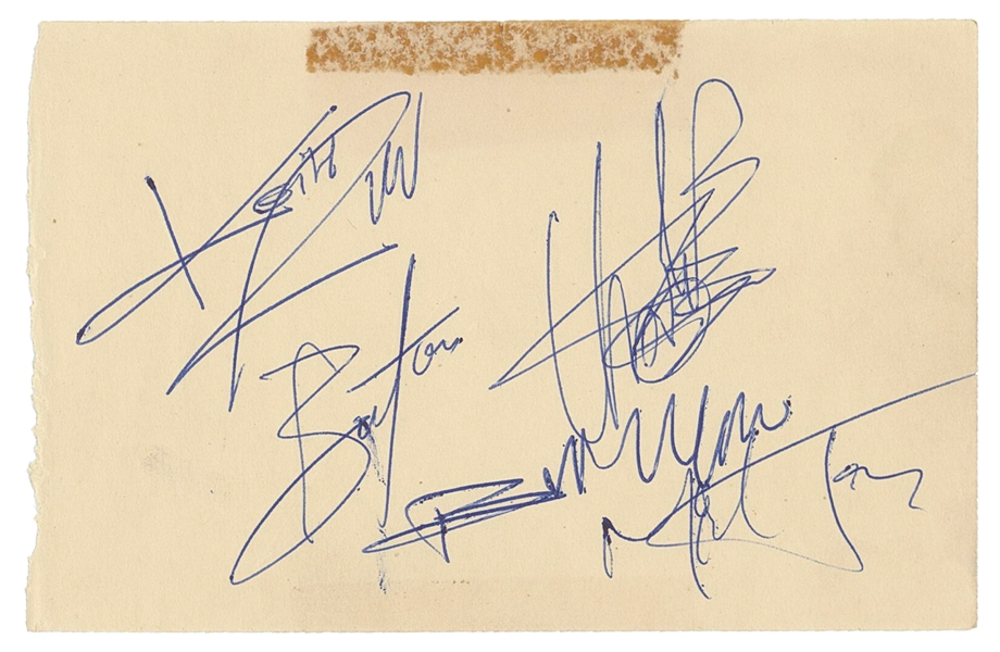  THE ROLLING STONES. Autograph album page signed by the band...