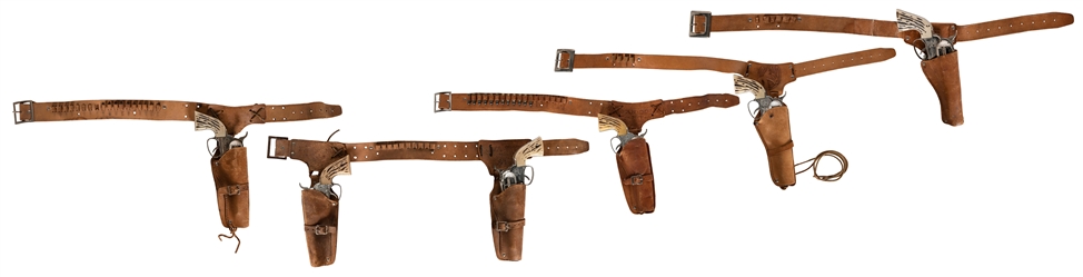  Group of 4 single Fanner 50 cowhide holsters with guns, and...