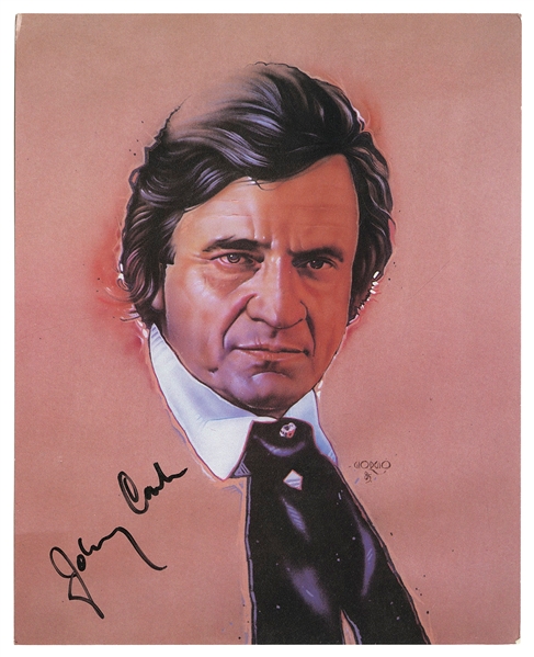  CASH, Johnny (1932-2003). Signed photo. [Circa 1985]. Color...