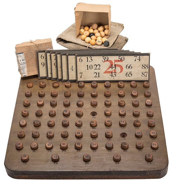  A Keno Ball Board With 73 (of 75) Wood Keno Balls, an H.E. ...