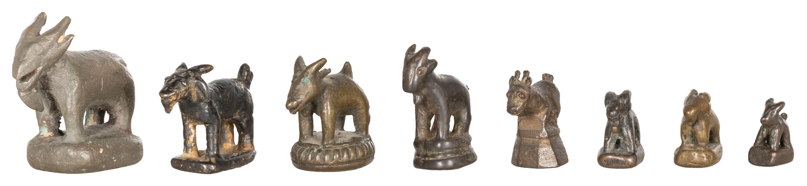  A group of 8 graduated metal goat opium weights. [Thailand?...