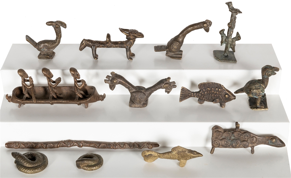  A group of 13 metal opium weights. [Thailand?, ca. 1880s]. ...