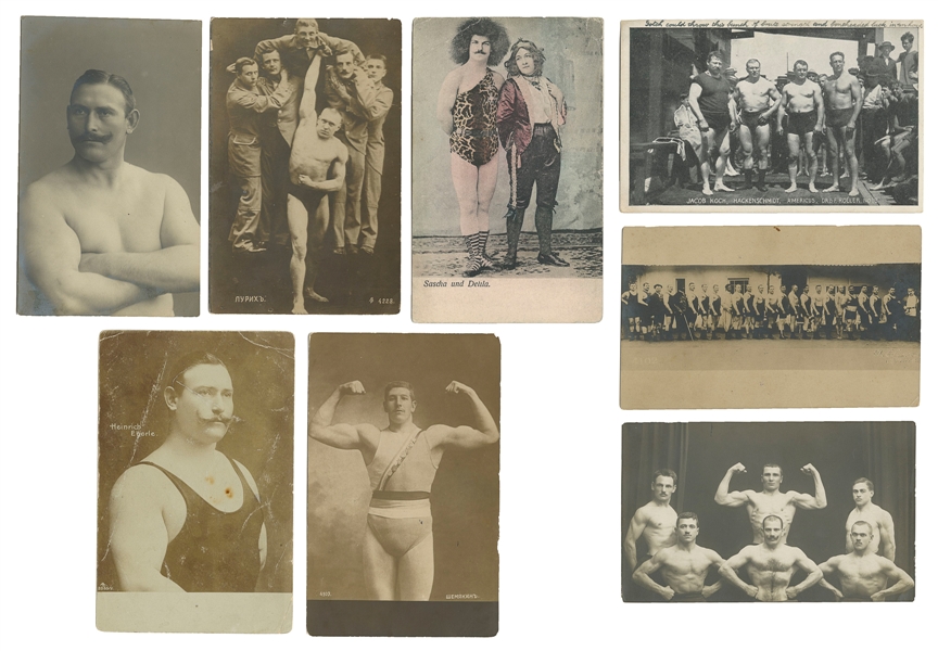  [STRONGMEN]. Group of eight strongmen, bodybuilder, and wei...