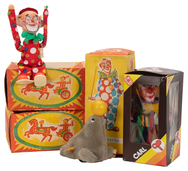  [WIND-UP TOYS]. Group of six wind-up clown toys and circus ...