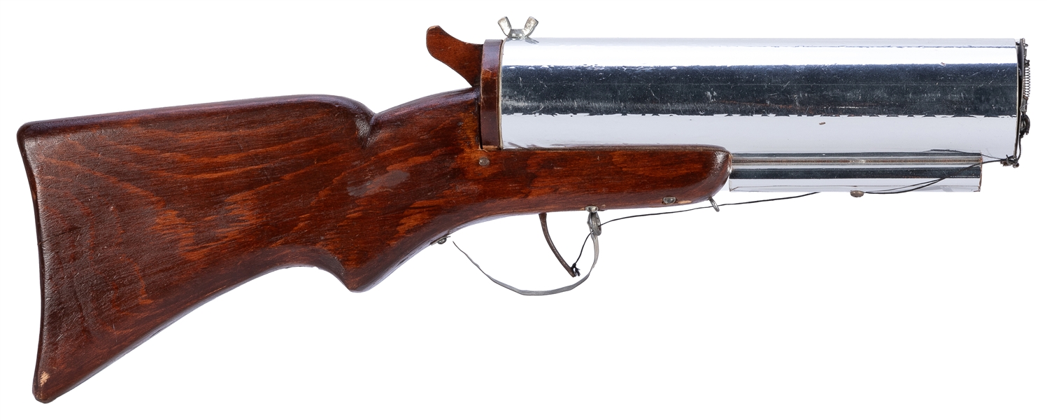  Spring Snake Gun. 1960s. A small rifle that shoots two larg...