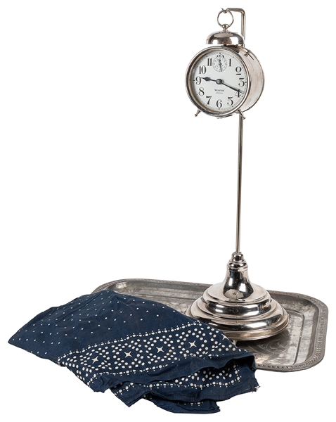  Vanishing Alarm Clock. Circa 1920s. A clock, covered by a c...