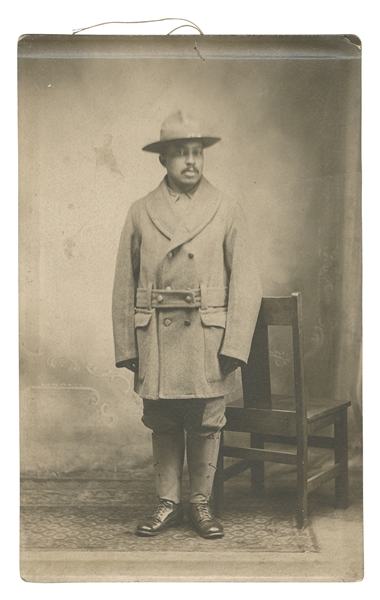  [AFRICAN AMERICAN]. A real photo postcard of an unidentifie...