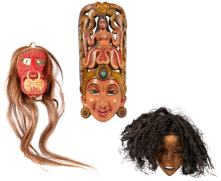  [MASKS] Three Vintage Handmade Wooden Masks. Twentieth cent...