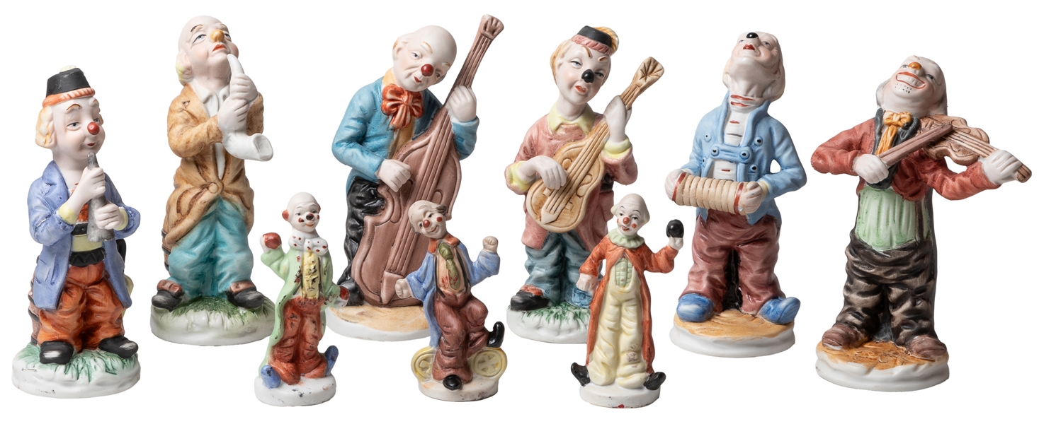  Group of 13 clown figurines. Group of porcelain, ceramic, w...