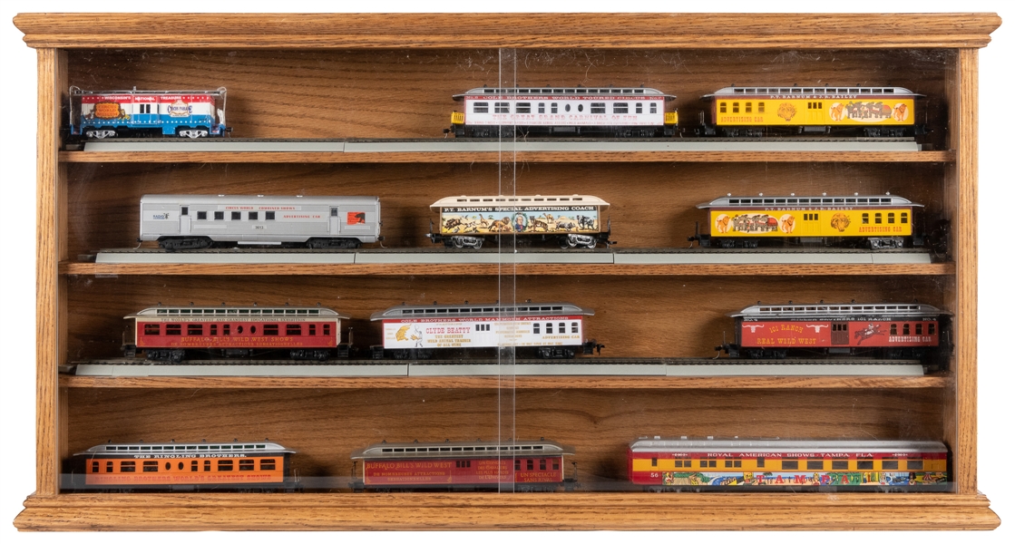  Cabinet Display of HO Circus Model Trains. Oak cabinet with...