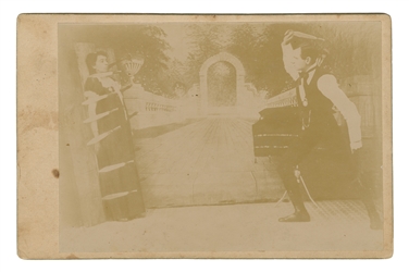  [KNIFE-THROWER]. Cabinet card. N.p., ca. 1880s-90s. Photogr...